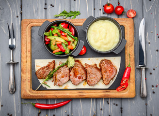 Juicy steak medium rare beef with spices and grilled vegetables