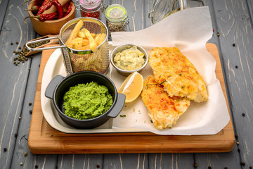 Fried cod fish with potatoes and sauce