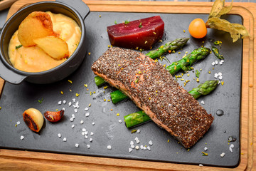 Grilled salmon fish with potatoes and chia seeds