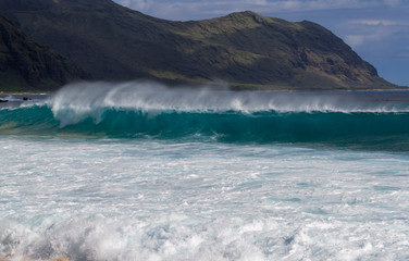 Shore waves breaking on the coast of Oahu Hawaii