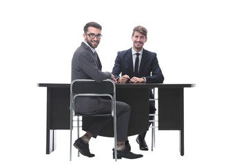 two business people talking sitting at a Desk