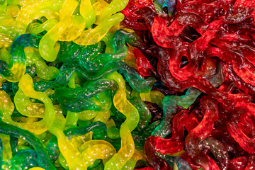 .Colored candies close-up. Jelly worms. Candy background.