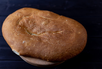 Pita bread on a wooden background