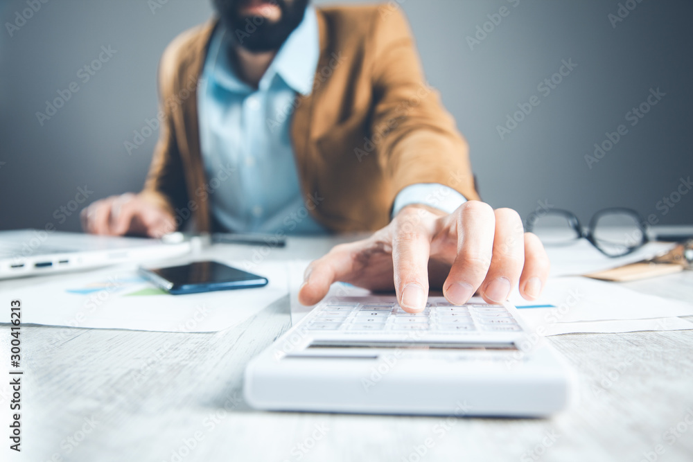 Poster man hand calculator with document on desk