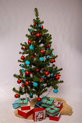 Christmas tree with toys and gifts on a white background