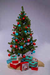 Christmas tree with toys and gifts on a white background