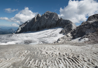 Panoramic view of gigantic glacier, melting snow
