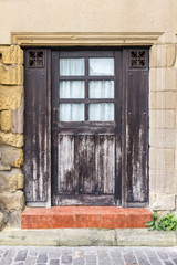 Old basque wooden door damaged by years