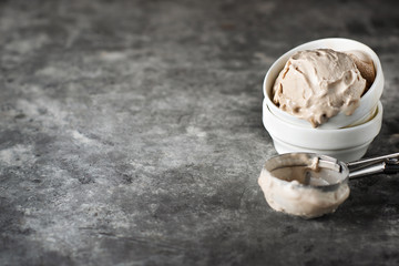 caramel ice cream in a white bowl