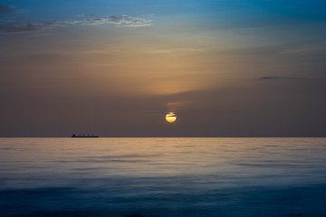 Sunrise over calm ocean