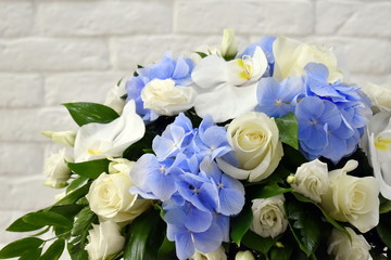 Romantic wedding white-blue bouquet. Soft tender composition on the table.