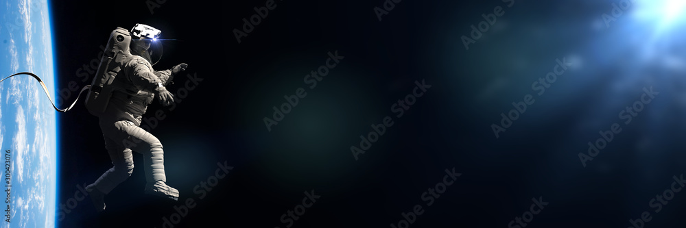 Canvas Prints astronaut in eva spacesuit performing a spacewalk