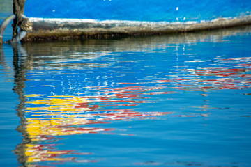 Traditional Malta fishing boat luzzu reflection in water