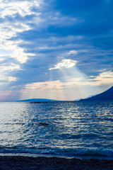 Crepuscular rays over the sea.