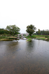 Fototapeta na wymiar stone arch bridge built in a park