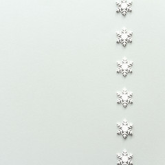 Christmas composition. White snowflake top view background with copy space for your text. Flat lay.