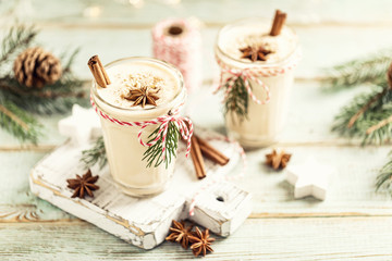 Eggnog. Traditional Christmas drink, spiced egg-milk cocktail with nut topping.