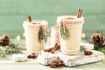 Eggnog. Traditional Christmas drink, spiced egg-milk cocktail with nut topping.