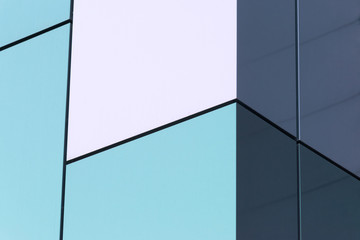 Geometric color elements of the building facade with planes, lines, corners with highlights and reflections for the abstract background and texture of white, turquoise, blue, colors. Place for text