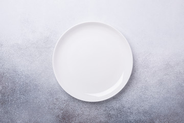 Empty white plate on stone background Copy space Top view - Image