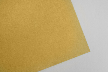 Fototapeta premium Paper background with paper texture yellow. Overlaid sheets of paper.