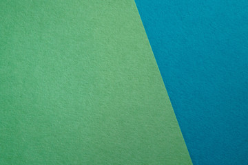 Fototapeta premium Paper background with paper texture in different colors. Overlaid sheets of paper.