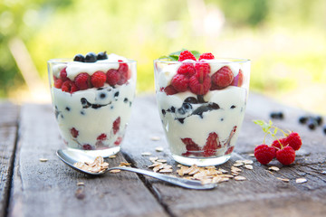 Natural yogurt with fresh berries and muesli. Healthy dessert