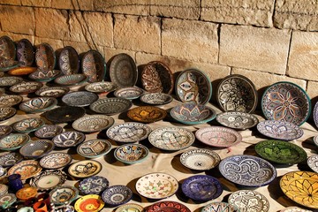 Ceramic plates for sale at a market stall
