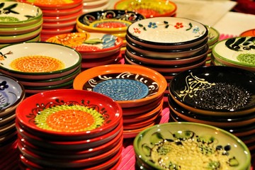 Ceramic plates for sale at a market stall