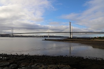 New and old Forth Road Bridges spanning the Firth of Forth at low tide