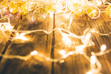 Christmas fairy lights on a wooden table