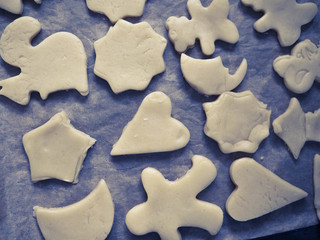 cut out molds dough for homemade cookies.