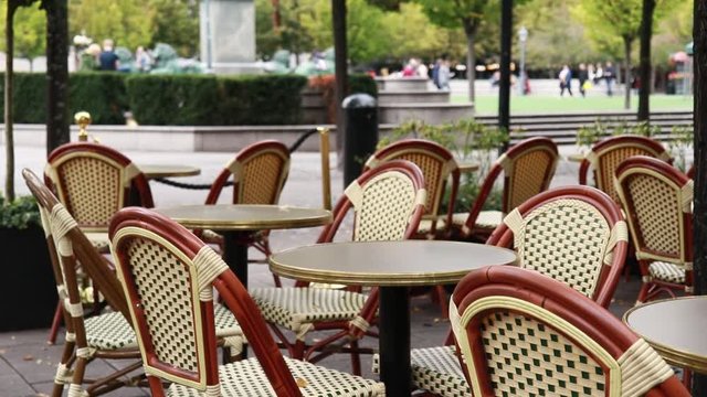 cafe with free tables and chairs on the street