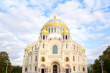 Fototapeta na wymiar Nicholas the wonderworker's church on Anchor square in kronstadt town Saint Petersburg. Naval christian cathedral church in russia with golden dome, unesco architecture at sunny day horyzontal