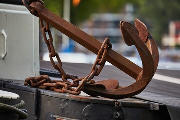 Old rusty anchor on the quay