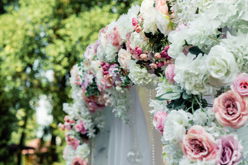 wedding arch decorated with beautiful flowers