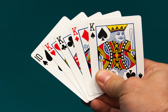 five different play cards in a hand