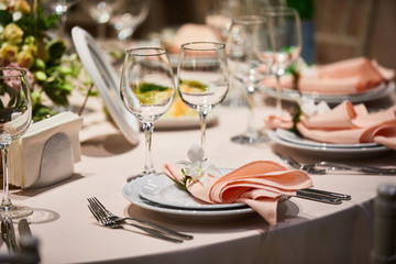 A luxurious covered table for the holiday in an expensive restaurant.