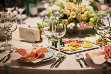 A luxurious covered table for the holiday in an expensive restaurant.