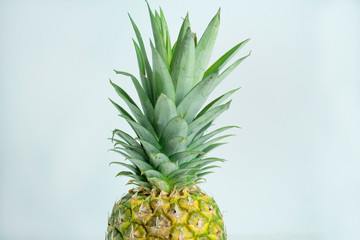 Fototapeta premium Fresh tropical pineapple isolated on a white background. Space for text.