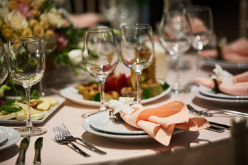 A luxurious covered table for the holiday in an expensive restaurant.
