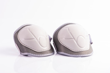 White children's knee pads on a white background - Powered by Adobe