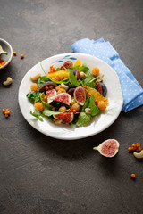 Vegan salad with figs on plate