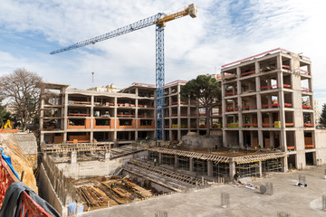 High-rise crane and construction site