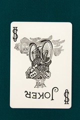 jocker play card on a green background
