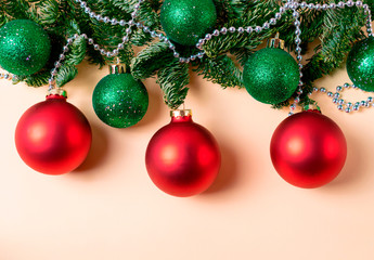 Red and green christmas balls with fir tree branches and silver beads decoration