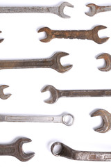 Old rusty stainless steel crescent wrench isolated on white top view