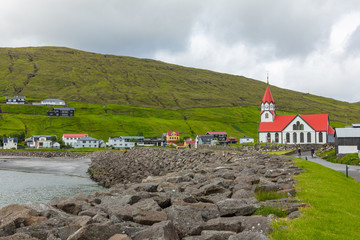 Lutheran Church With Red Roof in Sandavagur village, Located On The Faroe Islands, Denmark.