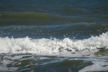 Waves on dark blue ocean water background in Florida beach