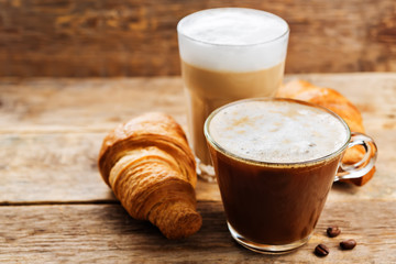 Coffee drink with fresh croissants